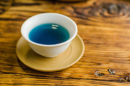 Organic blue tea Anchan in a teapot and a cupsの写真素材
