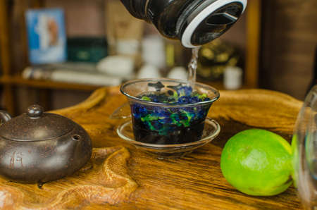 Organic blue tea Anchan in a teapot and a cupsの写真素材