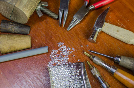 Desktop for craft jewellery making with professional tools. Copy spaceの写真素材