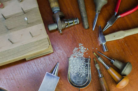 Desktop for craft jewellery making with professional tools. Copy spaceの写真素材