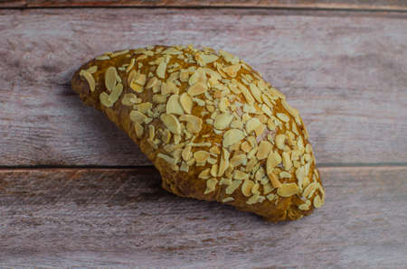 croissant on a wooden deck with decoration copy spaceの写真素材
