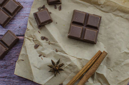 Cocoa drink with spices, zephyr and macaroons on wooden backgroundの写真素材