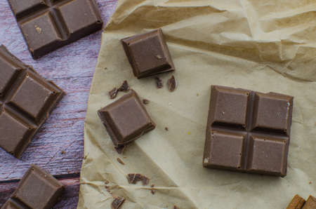 Cocoa drink with spices, zephyr and macaroons on wooden backgroundの写真素材