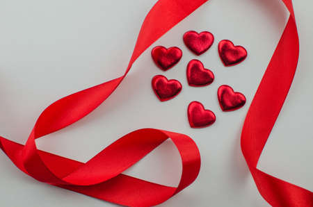Ribbons shaped as hearts on white, valentines day concept. copy spaceの写真素材