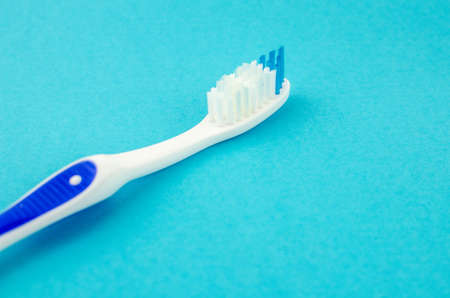 toothpaste and brush on a blue background with place for text. Health, cleanliness and beautyの写真素材