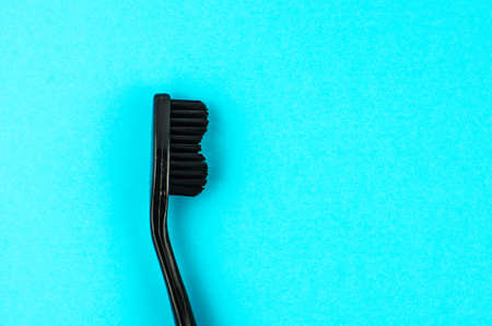 toothpaste and brush on a blue background with place for text. Health, cleanliness and beautyの写真素材