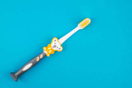 toothpaste and brush on a blue background with place for text. Health, cleanliness and beautyの写真素材