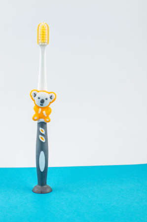 toothpaste and brush on a blue background with place for text. Health, cleanliness and beautyの写真素材