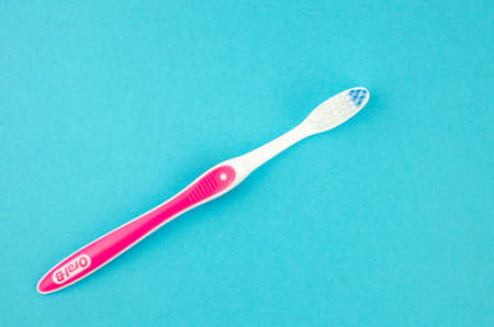 toothpaste and brush on a blue background with place for text. Health, cleanliness and beautyの写真素材
