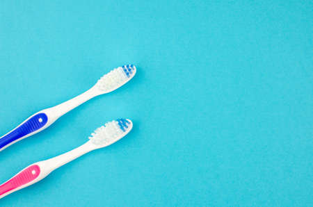 toothpaste and brush on a blue background with place for text. Health, cleanliness and beautyの写真素材