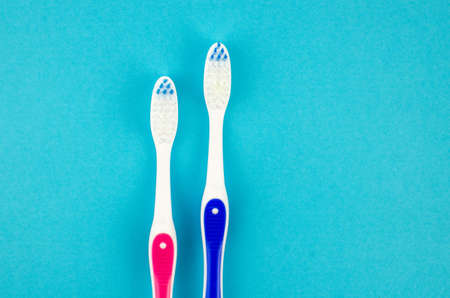 toothpaste and brush on a blue background with place for text. Health, cleanliness and beautyの写真素材