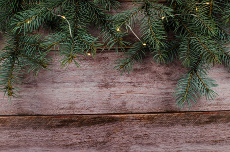 Gift boxes with a large red bow against a background bokeh of twinkling party lights. Luxury New...