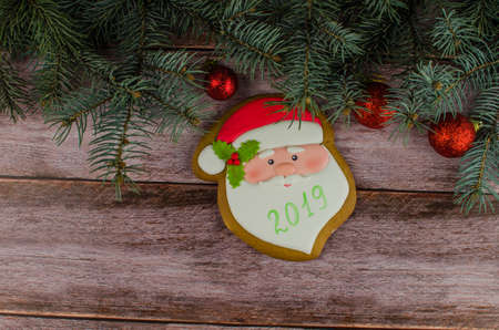 Gift boxes with a large red bow against a background bokeh of twinkling party lights. Luxury New Year gift. Christmas gift. Christmas background with gift box. Christmastime celebration. Copy space to text.の写真素材