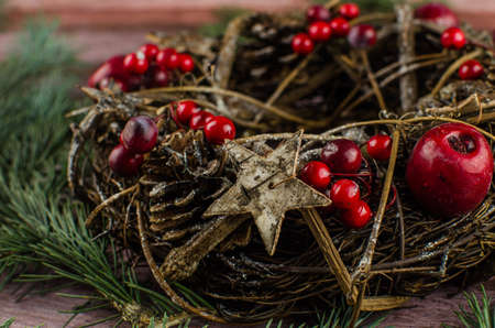 Gift boxes with a large red bow against a background bokeh of twinkling party lights. Luxury New Year gift. Christmas gift. Christmas background with gift box. Christmastime celebration. Copy space to text.の写真素材