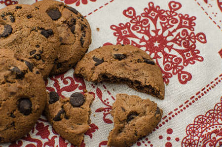 freshly baked chocolate chip cookies on rustic wooden table. Copy space for textの写真素材