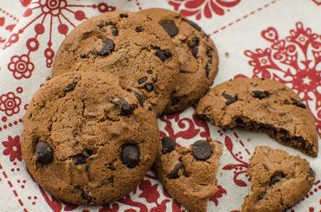 freshly baked chocolate chip cookies on rustic wooden table. Copy space for textの写真素材