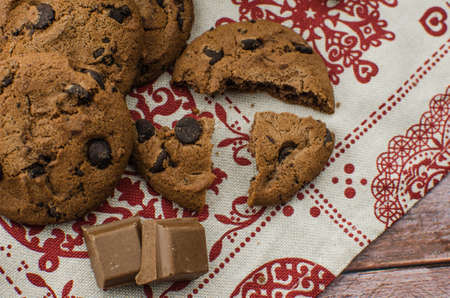 freshly baked chocolate chip cookies on rustic wooden table. Copy space for textの写真素材