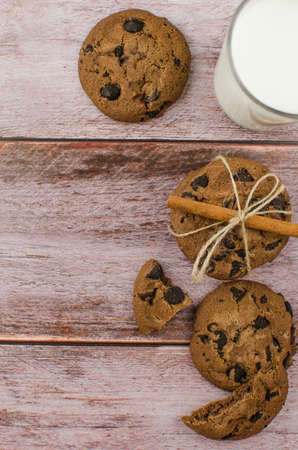 freshly baked chocolate chip cookies on rustic wooden table. Copy space for textの写真素材