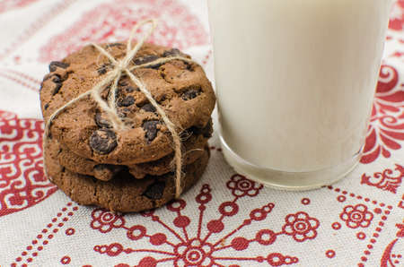 freshly baked chocolate chip cookies on rustic wooden table. Copy space for textの写真素材