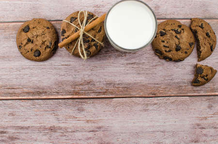 freshly baked chocolate chip cookies on rustic wooden table. Copy space for textの写真素材