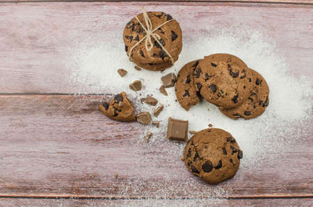 freshly baked chocolate chip cookies on rustic wooden table. Copy space for textの写真素材