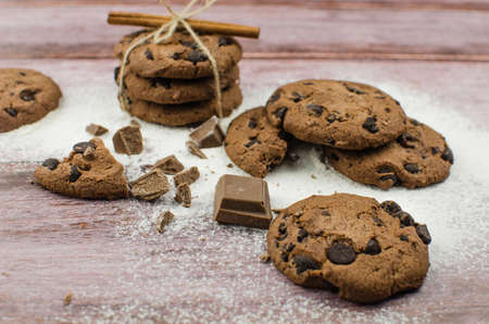 freshly baked chocolate chip cookies on rustic wooden table. Copy space for textの写真素材