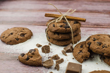 freshly baked chocolate chip cookies on rustic wooden table. Copy space for textの写真素材