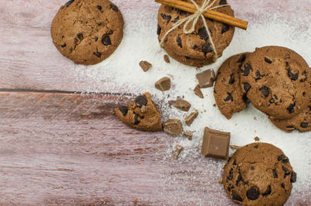 freshly baked chocolate chip cookies on rustic wooden table. Copy space for textの写真素材
