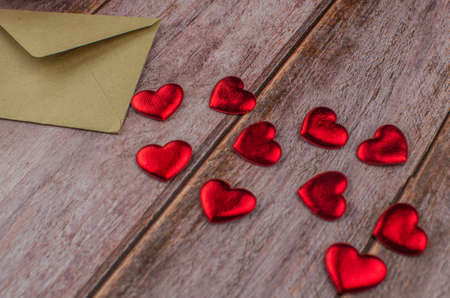 Red rose and Valentines day hearts on wood. copy space for textの写真素材