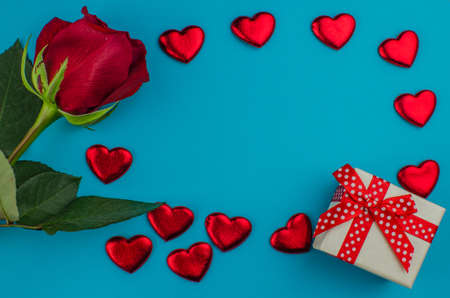 Red rose and Valentines day hearts on wood. copy space for textの写真素材