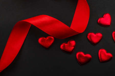 Red rose and Valentines day hearts on wood. copy space for textの写真素材