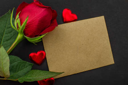 Red rose and Valentines day hearts on wood. copy space for textの写真素材