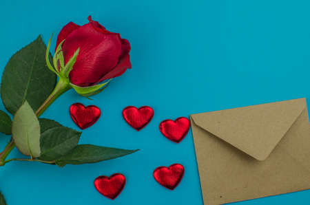 Red rose and Valentines day hearts on wood. copy space for textの写真素材