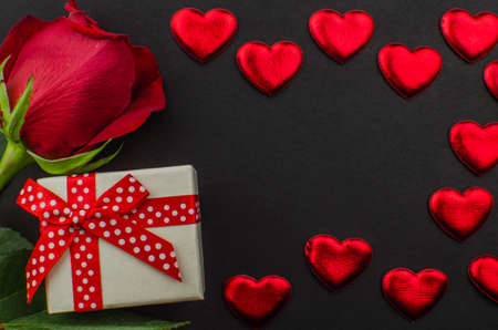 Red rose and Valentines day hearts on wood. copy space for textの写真素材