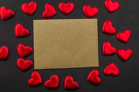 Red rose and Valentines day hearts on wood. Top view with copy spaceの写真素材