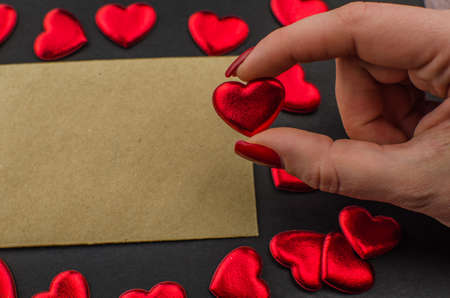 Red rose and Valentines day hearts on wood. Top view with copy spaceの写真素材