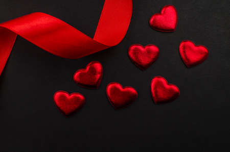 Red rose and Valentines day hearts on wood. Top view with copy spaceの写真素材