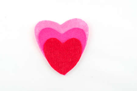 Hand made textile red heart. Isolated on white background. Copy spaceの写真素材