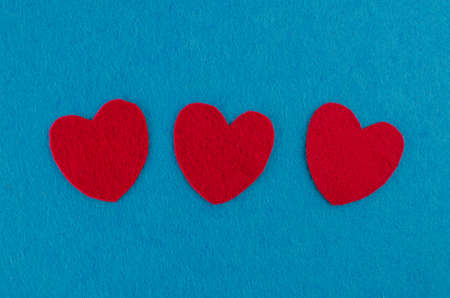 Hand made textile red heart. Isolated on white background. Copy spaceの写真素材
