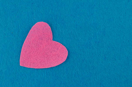 Hand made textile red heart. Isolated on white background. Copy spaceの写真素材
