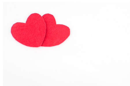 Hand made textile red heart. Isolated on white background. Copy spaceの写真素材