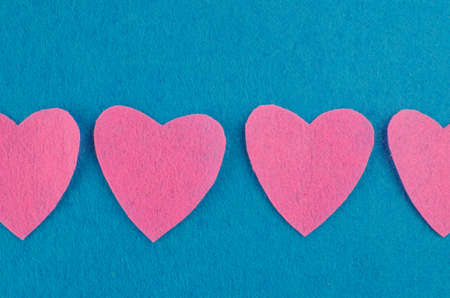 Hand made textile red heart. Isolated on white background. Copy spaceの写真素材