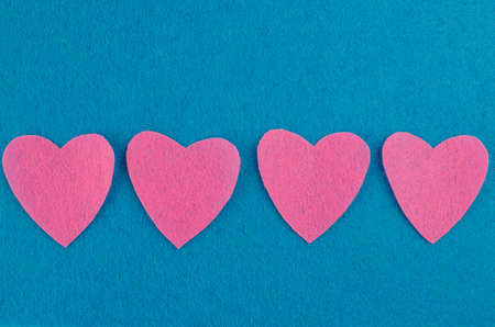 Hand made textile red heart. Isolated on white background. Copy spaceの写真素材