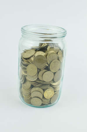 coins on an isolated background. Saving money, accumulating for the realization of a dream. Copy space for textの写真素材