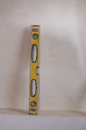 Close up of a spirit level showing horizontal with shallow depth of focus againstの写真素材