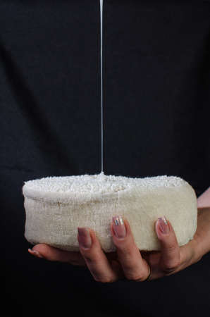 Luminous transparent gel as a drip on blackの写真素材