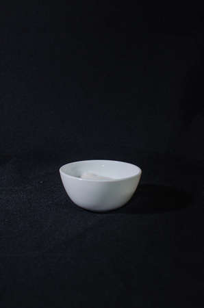 white salt on black backgroundの写真素材