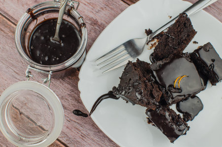 Sliced homemade brownies on white plate. Served on rectangle white plate. Favorite chocolate dessert...