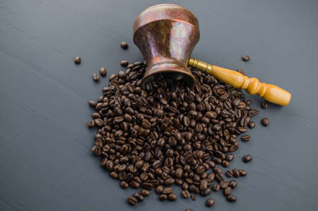 Turkish or Greek Coffee in heart shaped roasted coffee beans on white rustic wooden table from top view.の写真素材