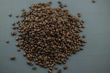 Turkish or Greek Coffee in heart shaped roasted coffee beans on white rustic wooden table from top view.の写真素材